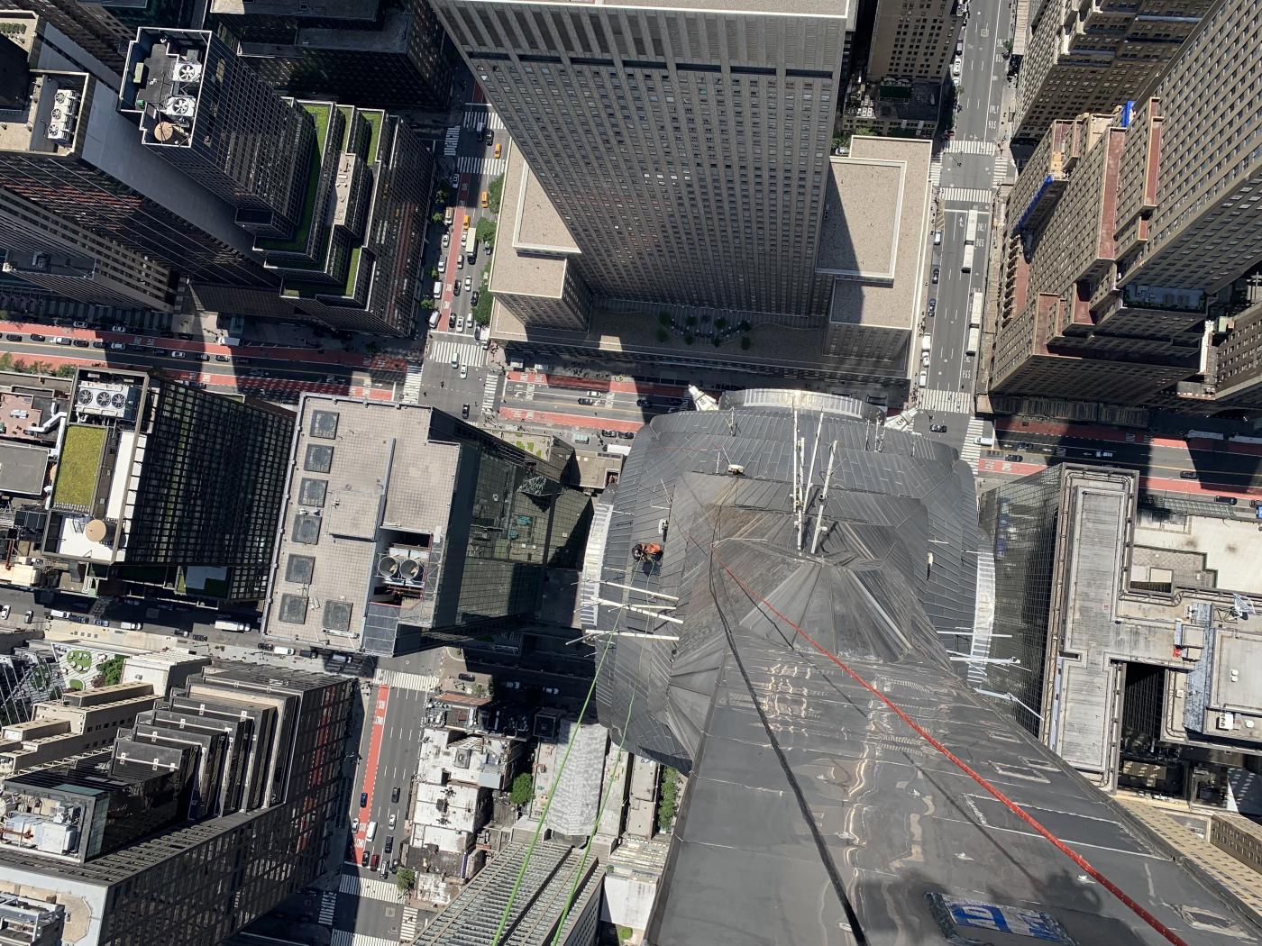 William Canup scaling down the Chrysler Building needle